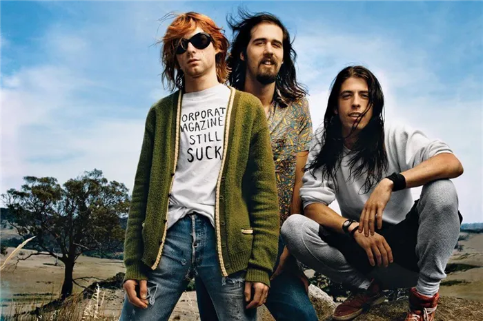 Группа Nirvana на фото слева направо: Курт Кобейн, Крист Новоселич, Дэвид Грол - американский дворецкий.